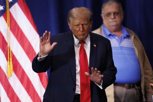 Donald Trump dances on stage following an address at the Kingswood Arts Center in Wolfeboro, New Hampshire.